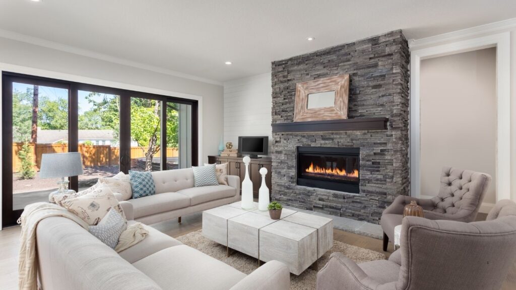 GREY TILE FIREPLACE WITH DOUBLE SOFAS AND ARMCHAIRS
