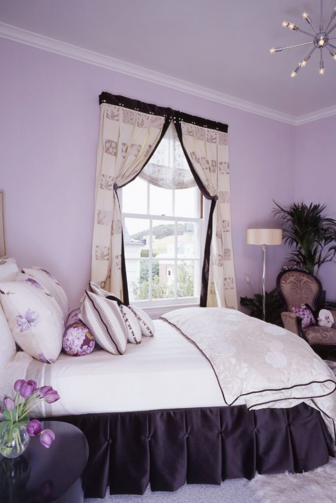 LILAC BEDROOM WITH ANTIQUE CHAIR