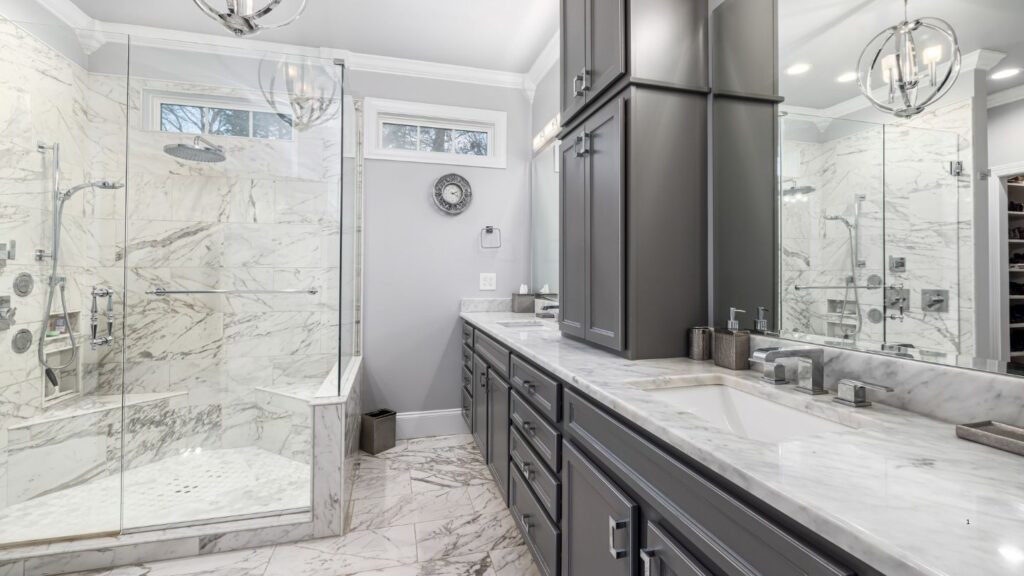 AESTHETIC ENCLOSED SIT DOWN SHOWER WITH GREY CABINETSS