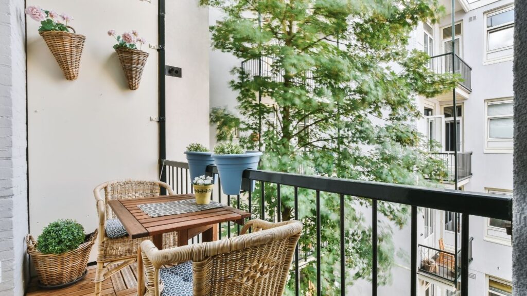 CANE DINING CHAIRS WITH WOODEN TABLE AND WALL HANGING CONE BASKETS